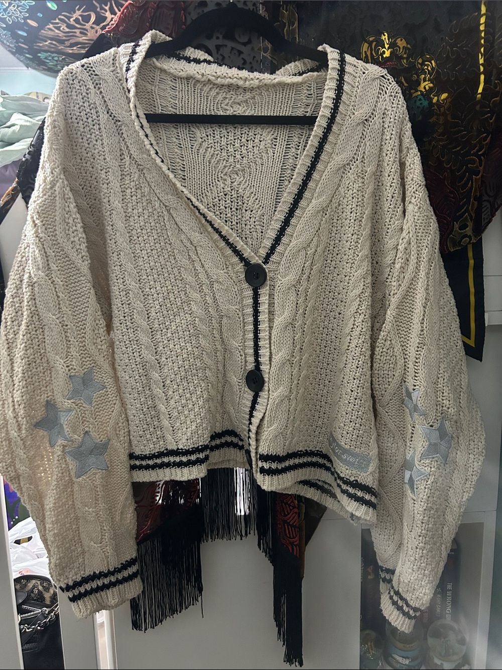 Taylor Swift Cream Cable-Knit Cardigan with Black Trim and Star Appliqués